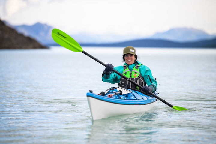 woman in sea kayak on a cool day