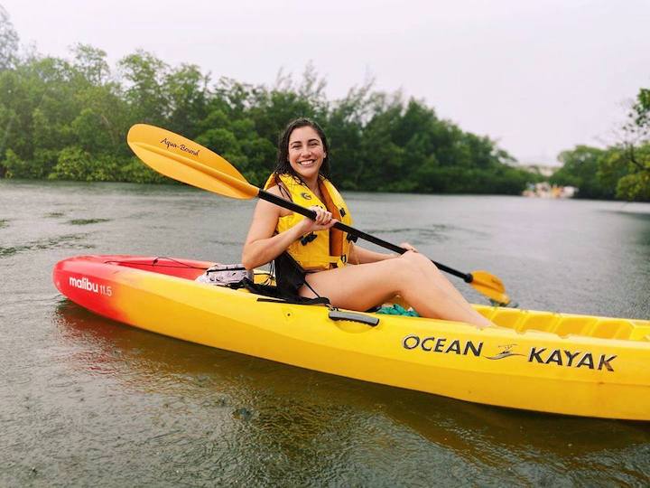 woman in sit-on-to kayak, smiling