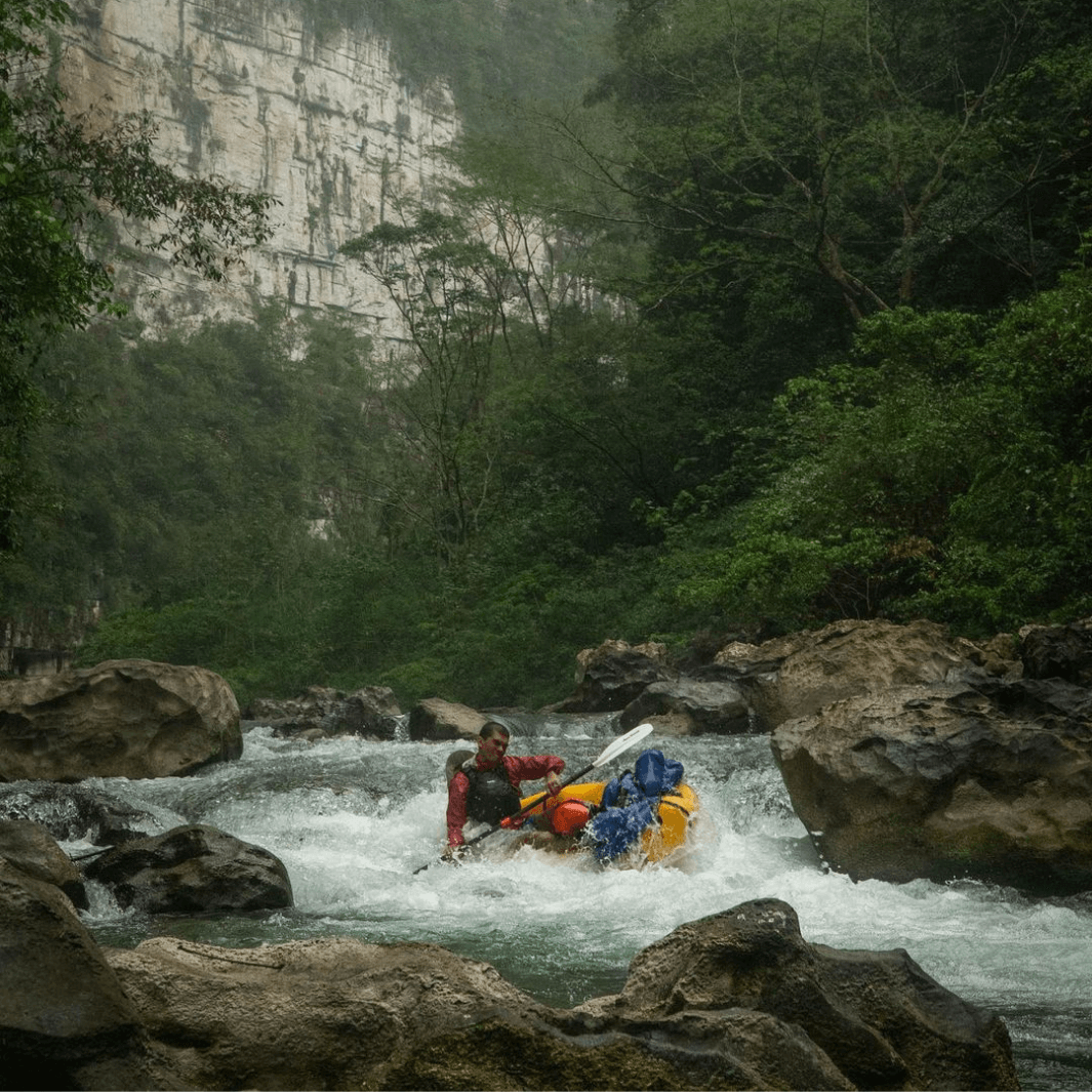 manta ray hybrid 2-piece posi-lok white being paddled through tough rapids#color_white