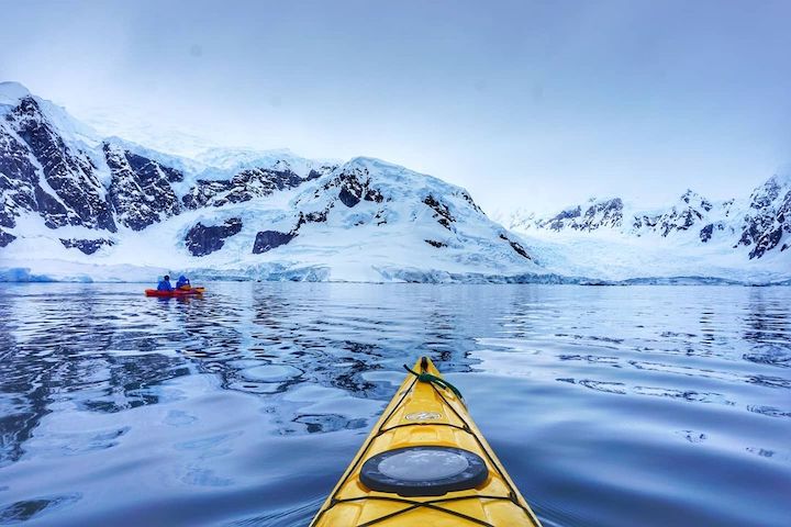 Kayakers in Antarctica's waters