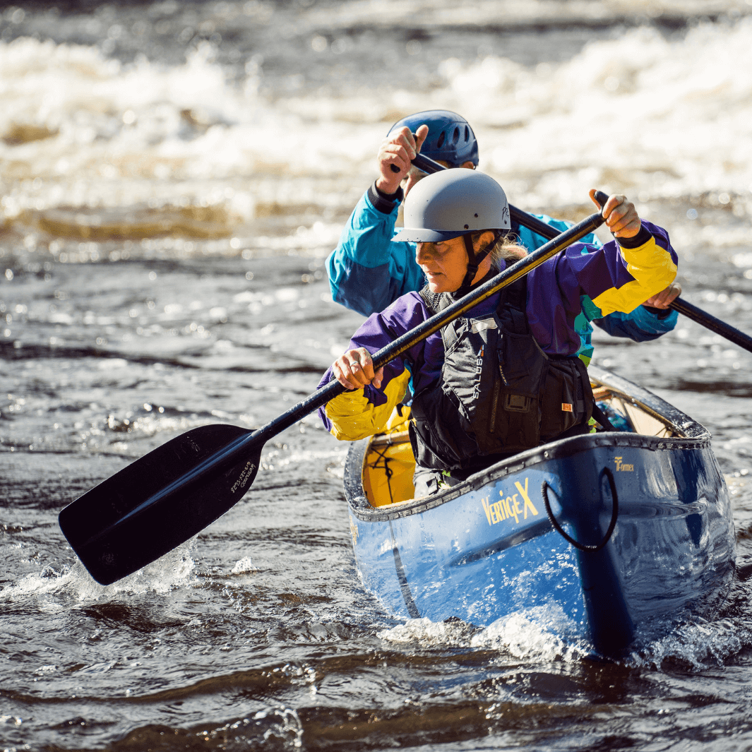 2 whitewater canoeists paddling with the edge 2-piece
