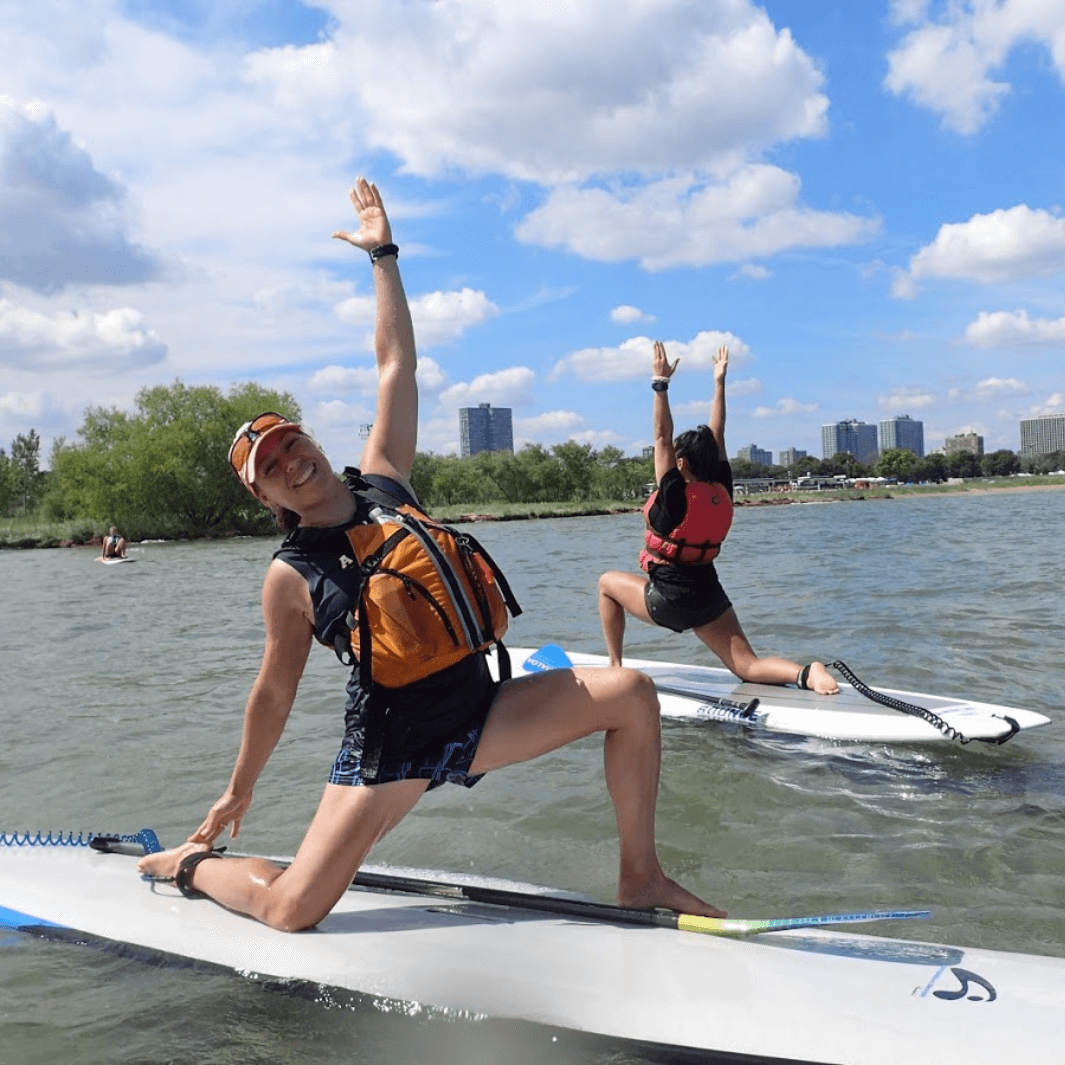 malta sunwave laying on paddle board while paddler does yoga pose#color_sunwave