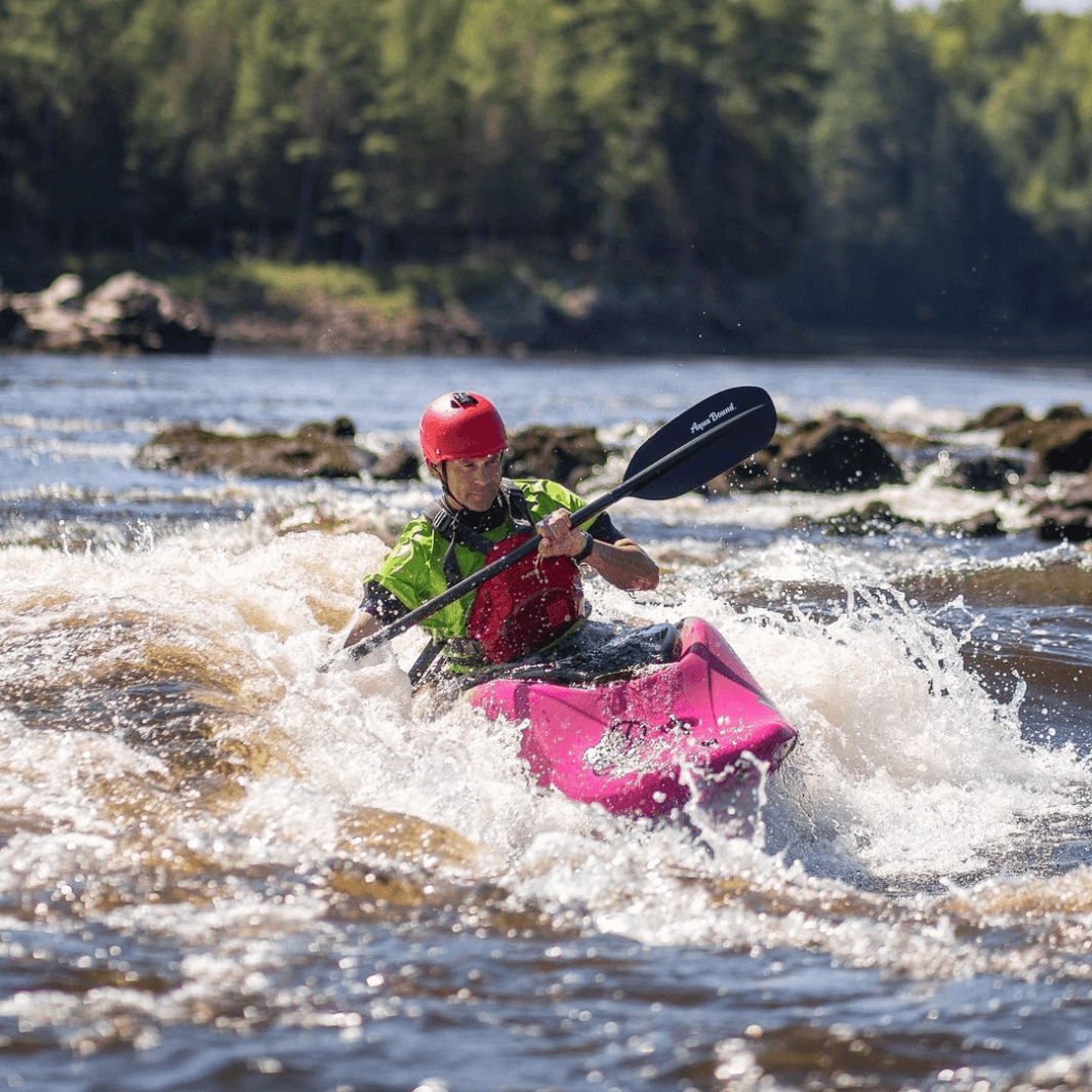 Ken Whiting paddling with the shred carbon 1-piece through whitewater rapids
