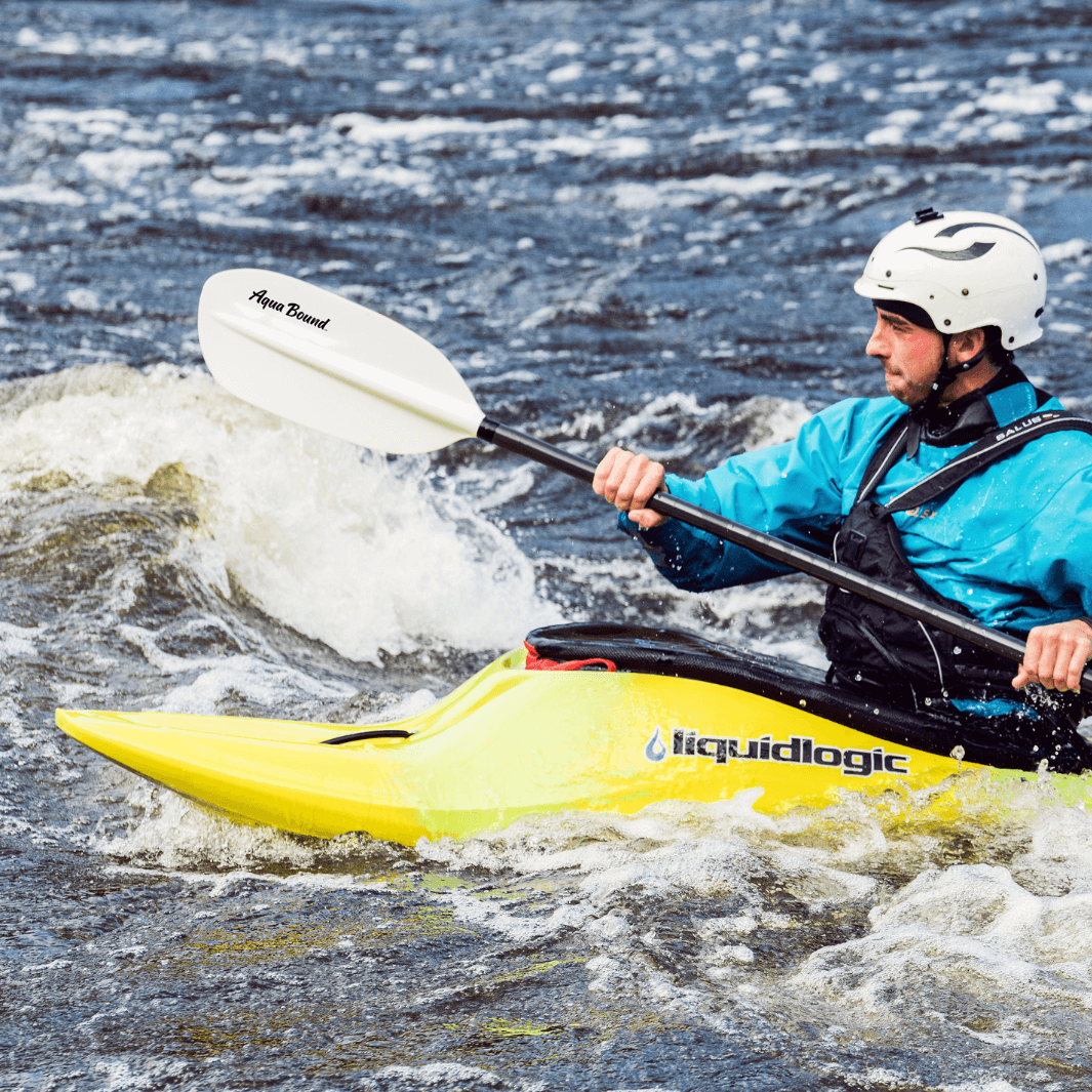 whitewater paddler using the shred hybrid 1-piece through rapids