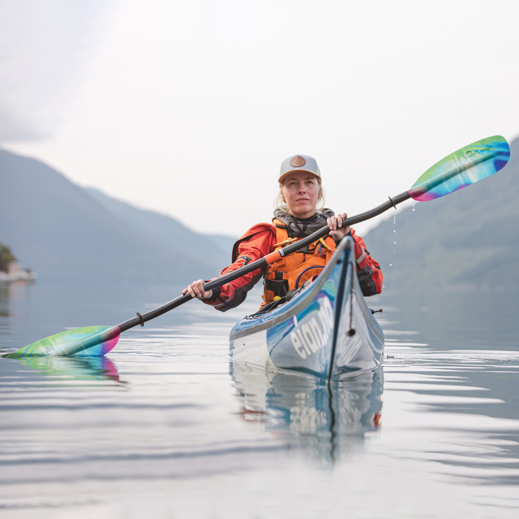 tango fiberglass bent shaft kayak paddle northern lights being paddled towards camera in Norway#color_northern-lights