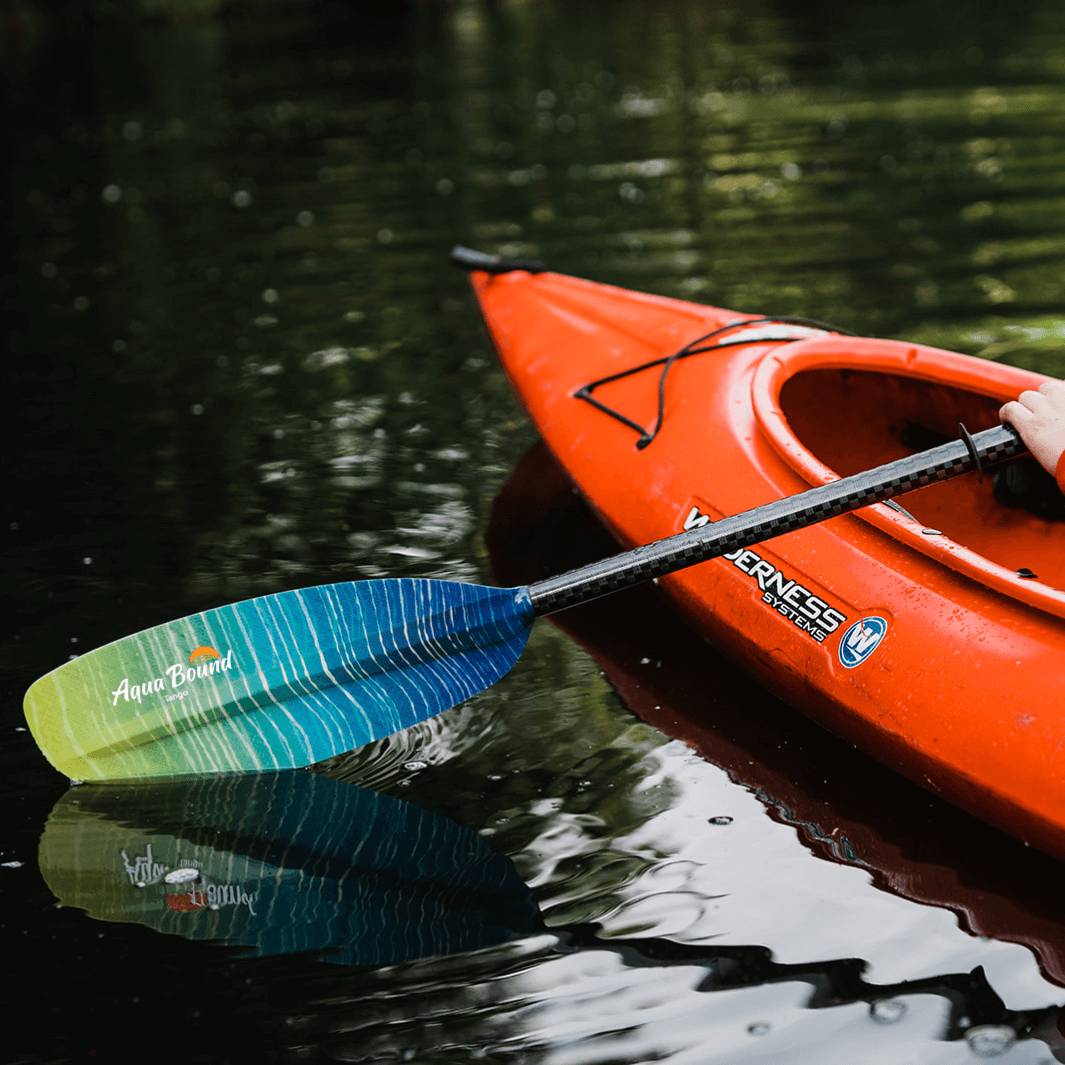 tango fiberglass 2-piece posi-lok kayak paddle sunwave partly in water#color_sunwave