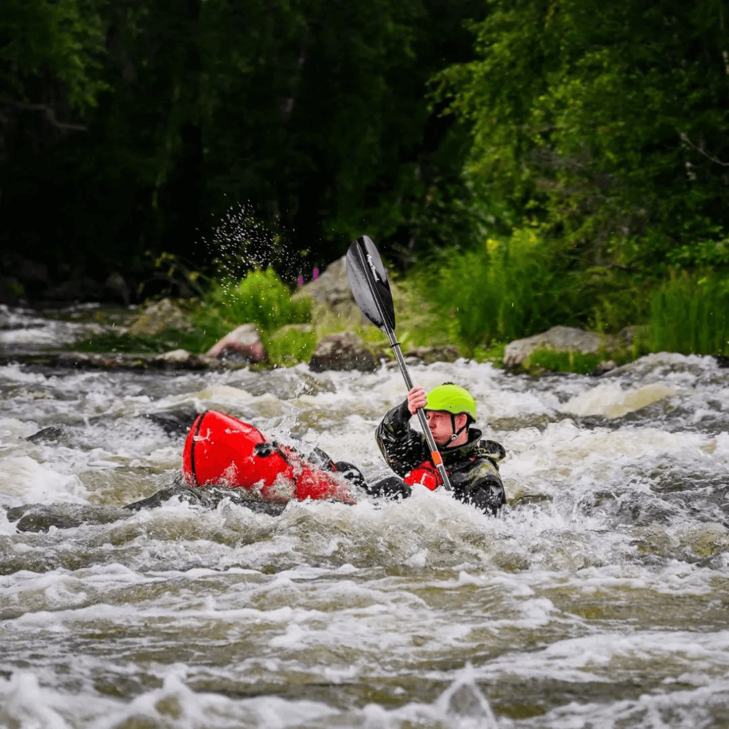 packrafter going through rapids
