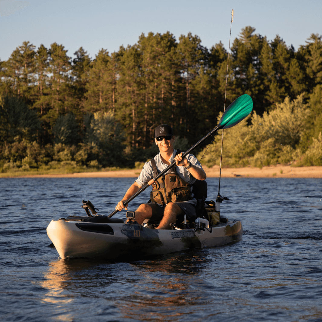 Ken Whiting with the Whiskey green tide in a fishing kayak#color_green-tide